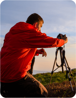 A creator is capturing an image with a tripod.