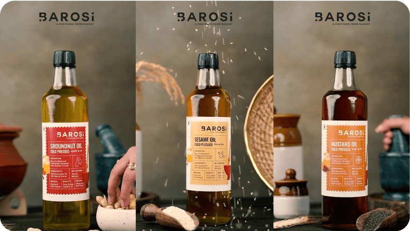 Four bottles of barrosi olive oil on a table for an Indievisual client