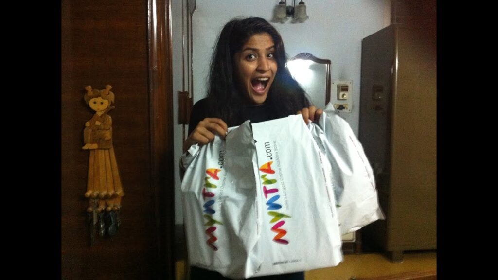 Woman holding Myntra bags