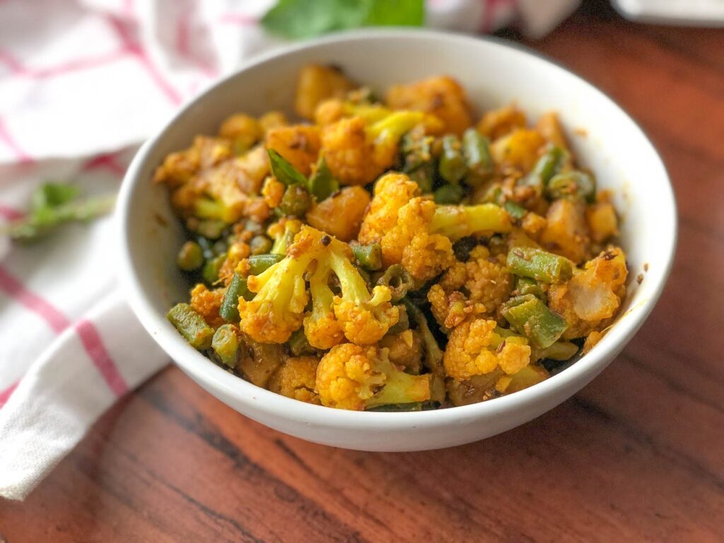 Spicy & Masaledar Aloo Gobi and Beans Tawa Sabzi from Archana’s Kitchen