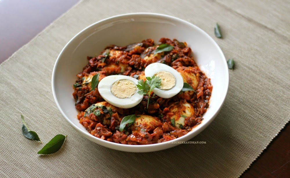 Egg-masala Garnished with Fresh Coriander and Curry leaves
